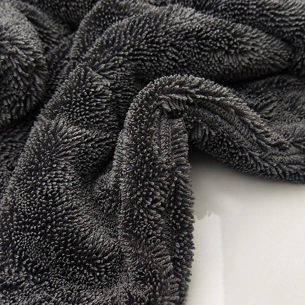 Grey square microfiber car wash towel for drying vehicles.