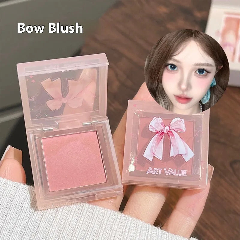 Butterfly Box makeup set with four pink lip mud pots, powder blusher, and necklace