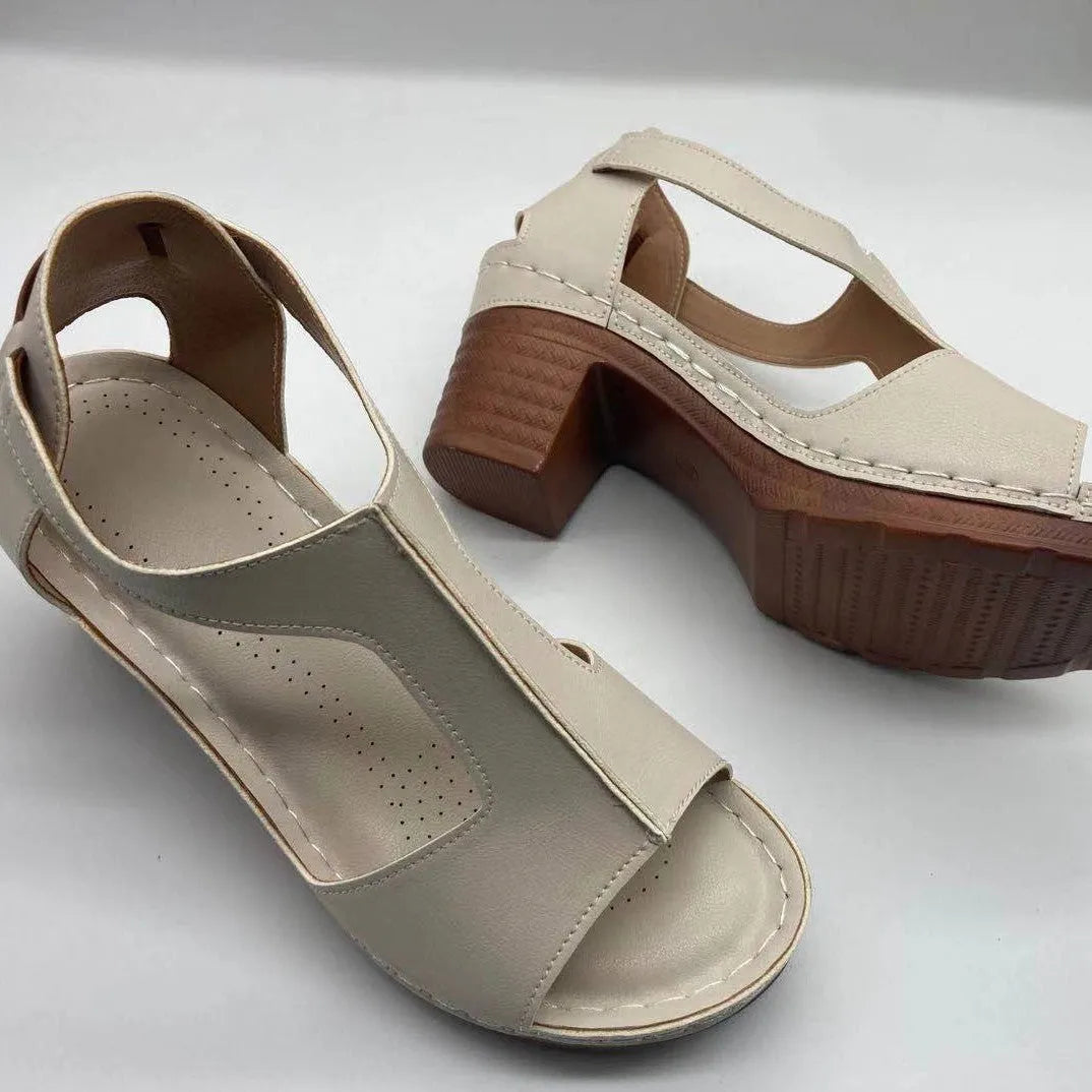 Women's peep toe wedge sandals with buckle detail, low heel, on a white background.