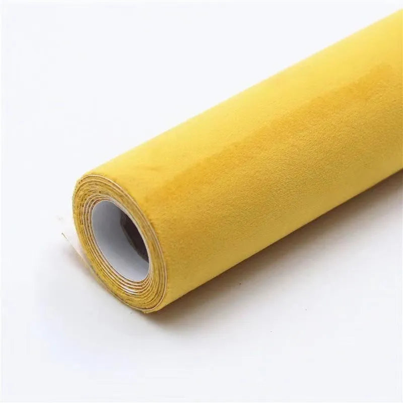 Rolls and sheets of coloured self-adhesive suede leather material for DIY projects.