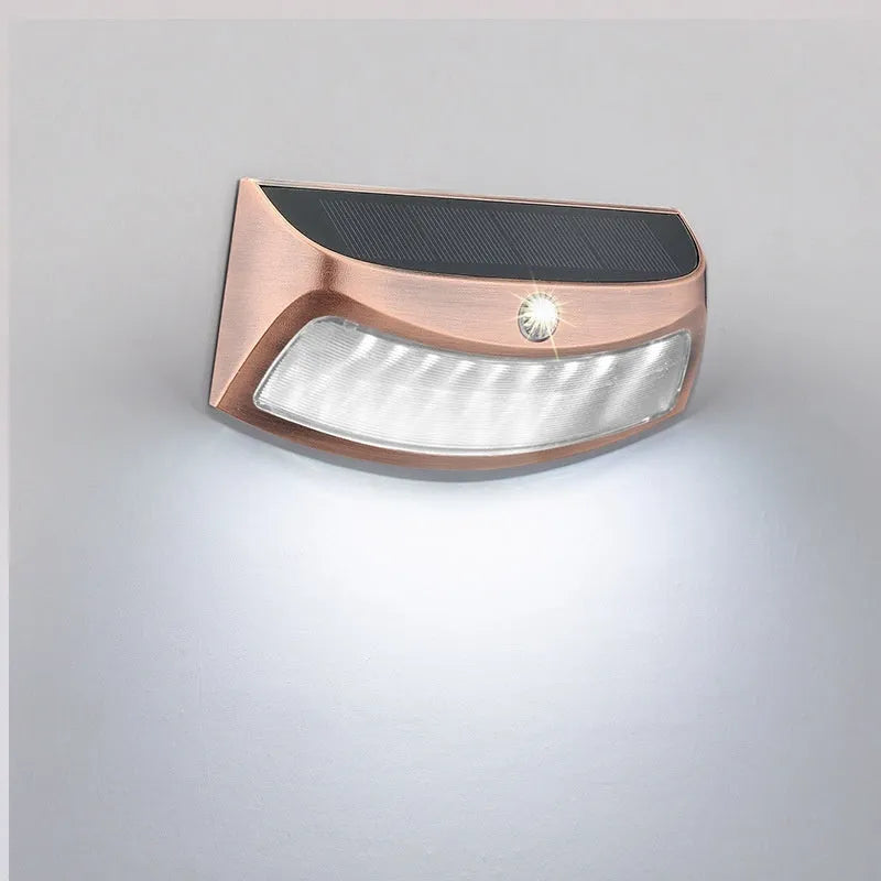 Solar-powered smiling face outdoor wall light for garden decoration