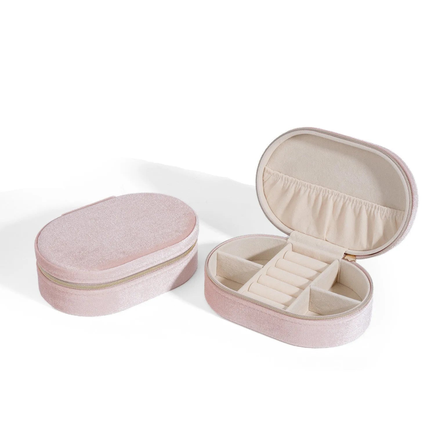 Oval velvet jewellery box with handle in lake blue colour, showing flannel-lined interior.