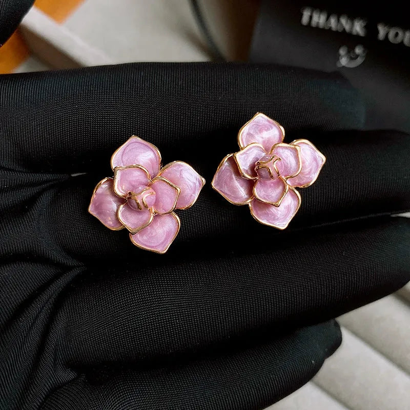 Gold plated purple oil-spot glaze flower stud earrings with fresh floral design and silver needle decoration