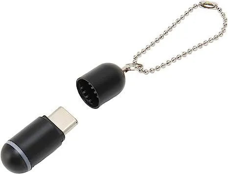Black capsule infrared remote adapter with smartphone connectors measuring 34x11x11mm
