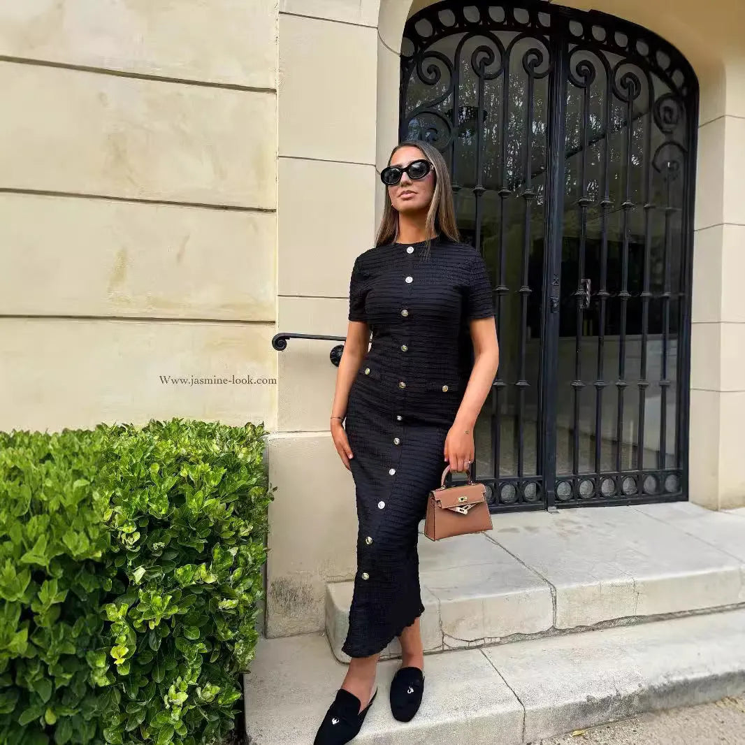 French retro slim fit knitted long-sleeved dress in black shown on a model.
