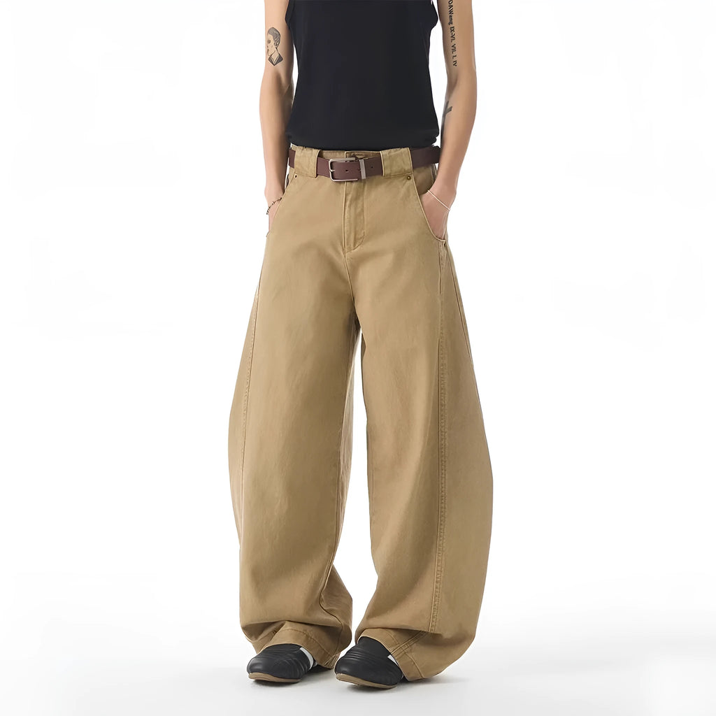 Brown men's loose fit straight leg denim jeans with a button fly, shown laid flat.