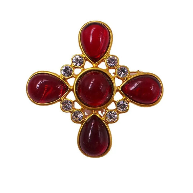 Medieval baroque crystal cross brooch in zinc alloy with ornate design on dark background