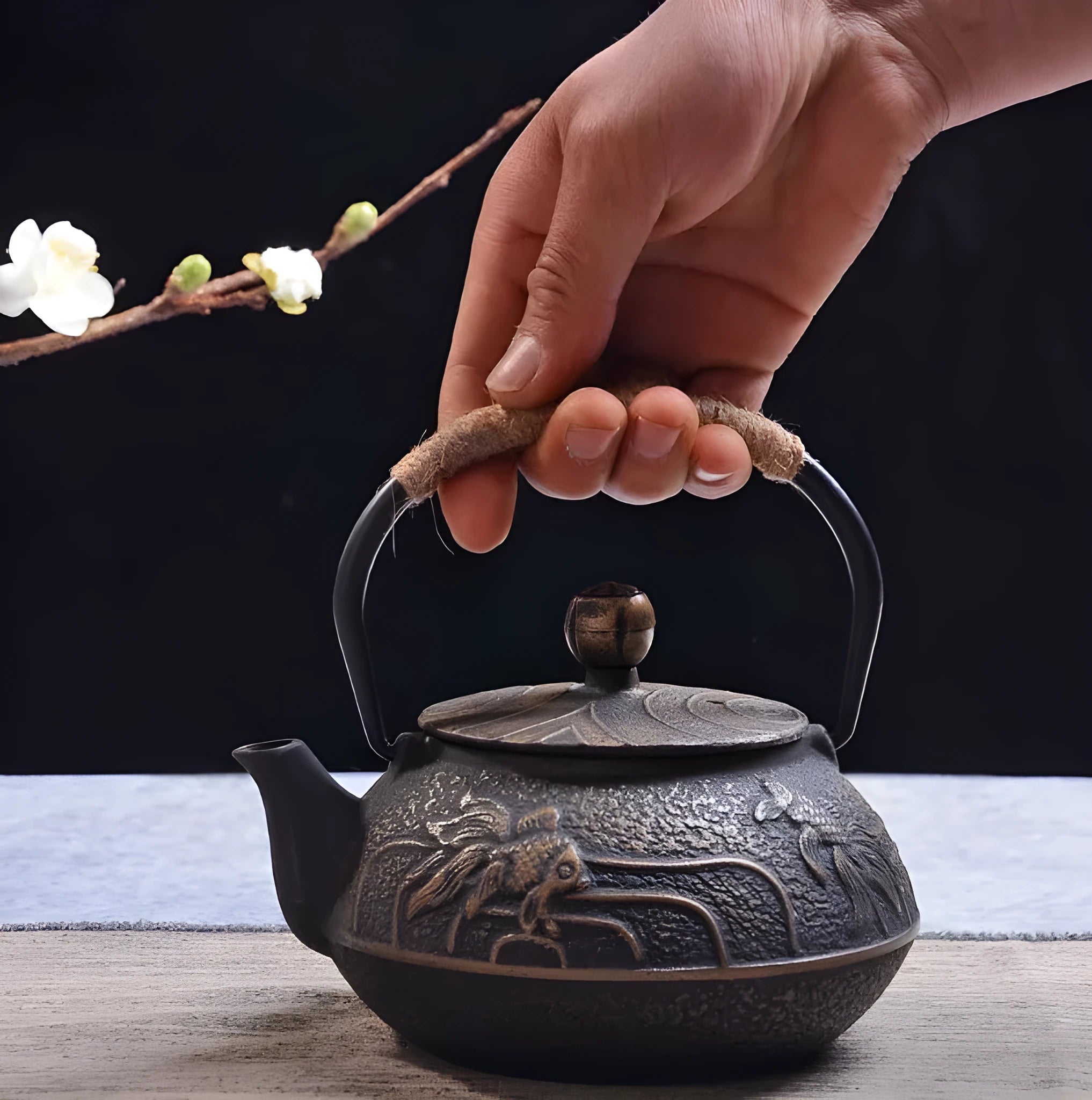Japanese style cast iron teapot with traditional design and 0.9L capacity for tea brewing