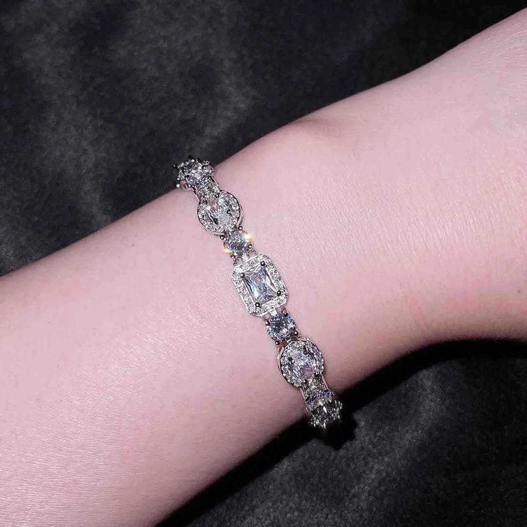 Women's sterling silver-plated bracelet with white gold finish and inlaid zircon stones.