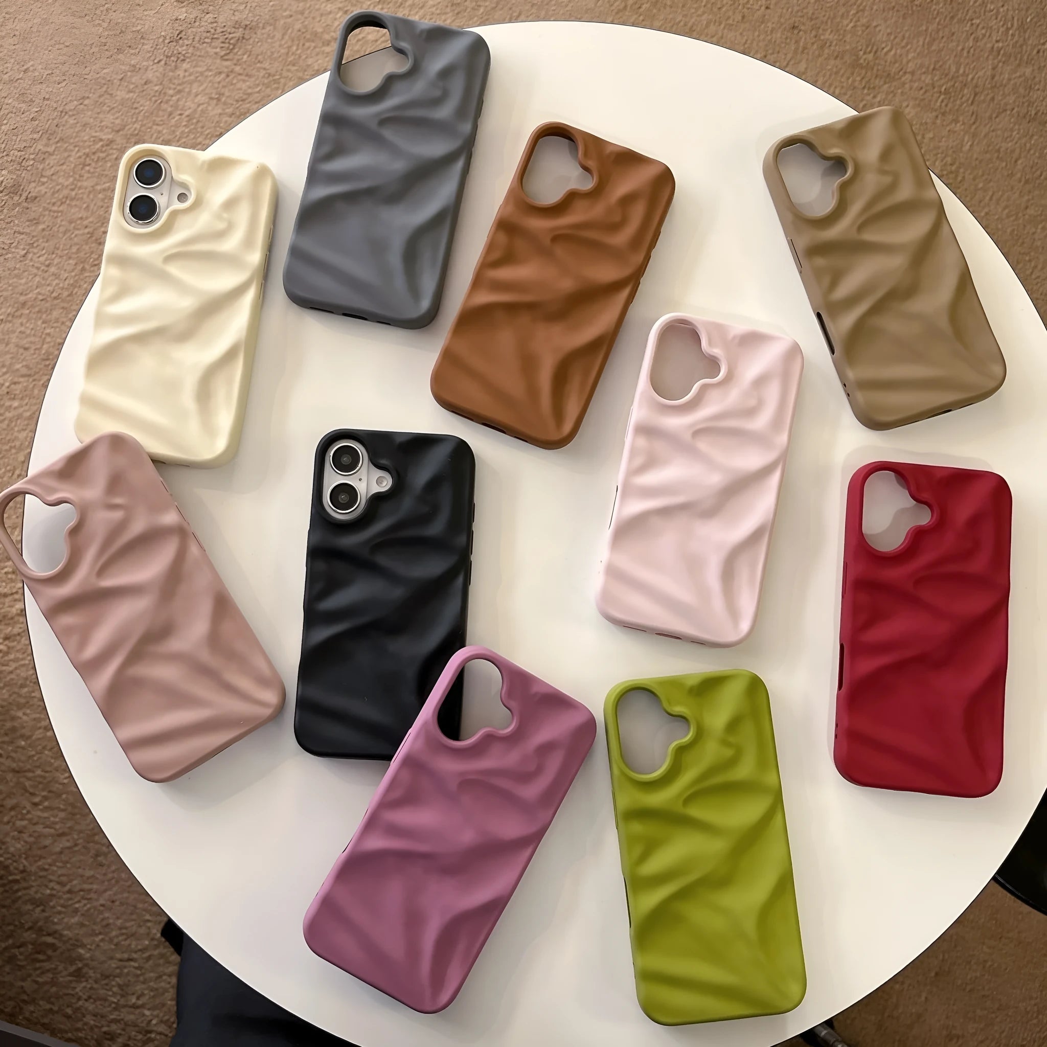 High-grade three-dimensional pleated pattern silicone phone case for iPhone 17 series in black, soft shell construction with fall protection