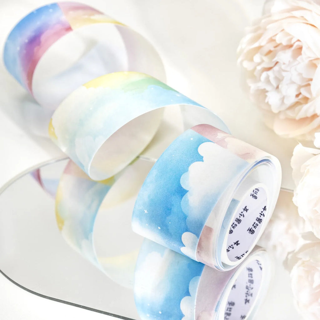 Japanese paper washi tape roll with celestial sky patterns including colourful clouds and twilight, 30mm width