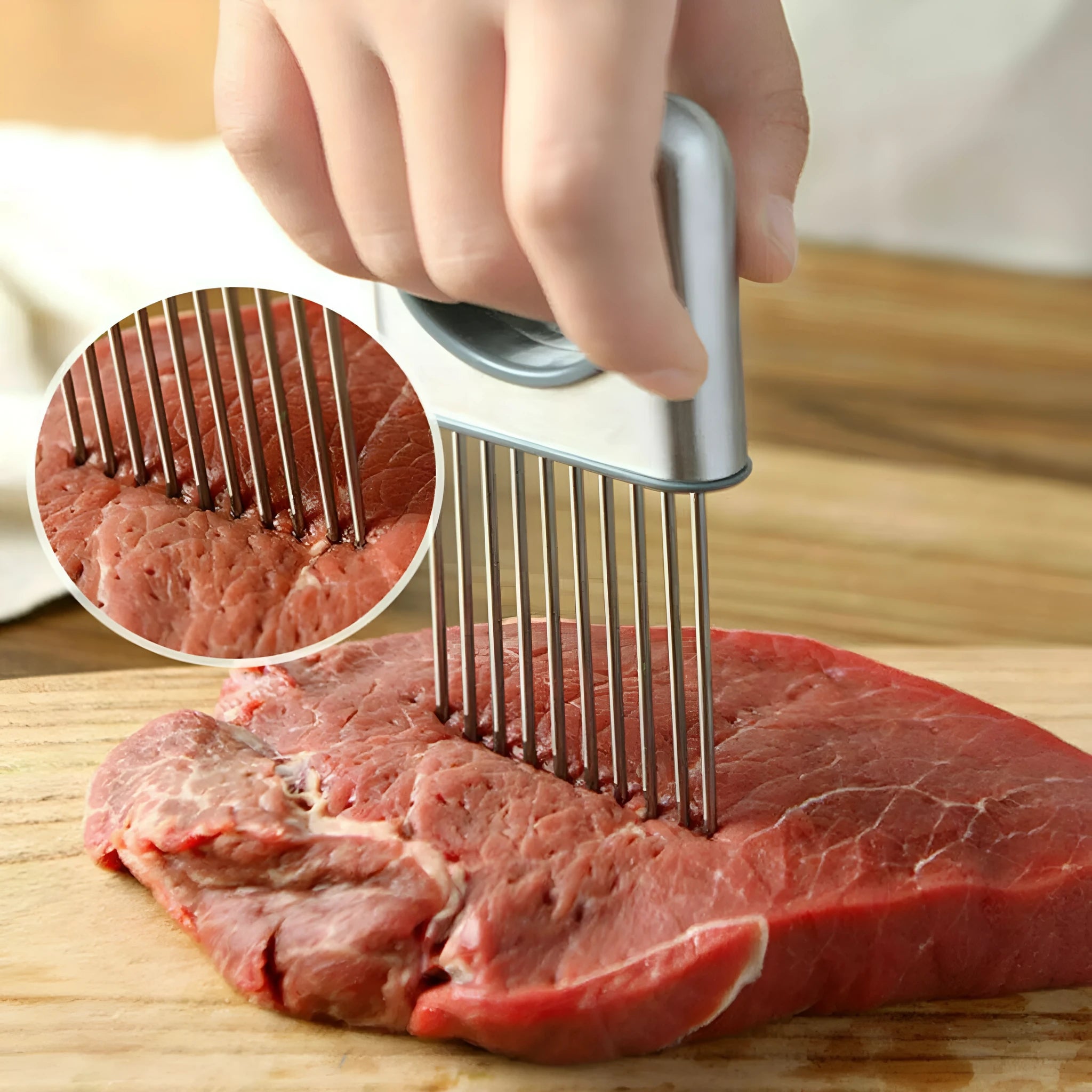 Stainless steel onion holder with ultra-sharp prongs and finger guard protector on a kitchen counter
