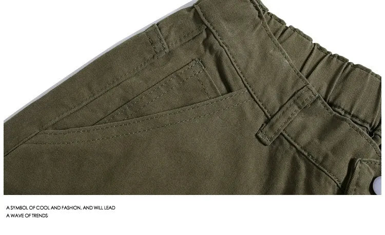 Women's workwear-style cropped pants in wide-leg shorts design with rivet detailing