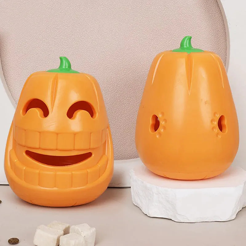 Orange Halloween pumpkin shaped dog chew toy with a treat-dispensing funnel hole
