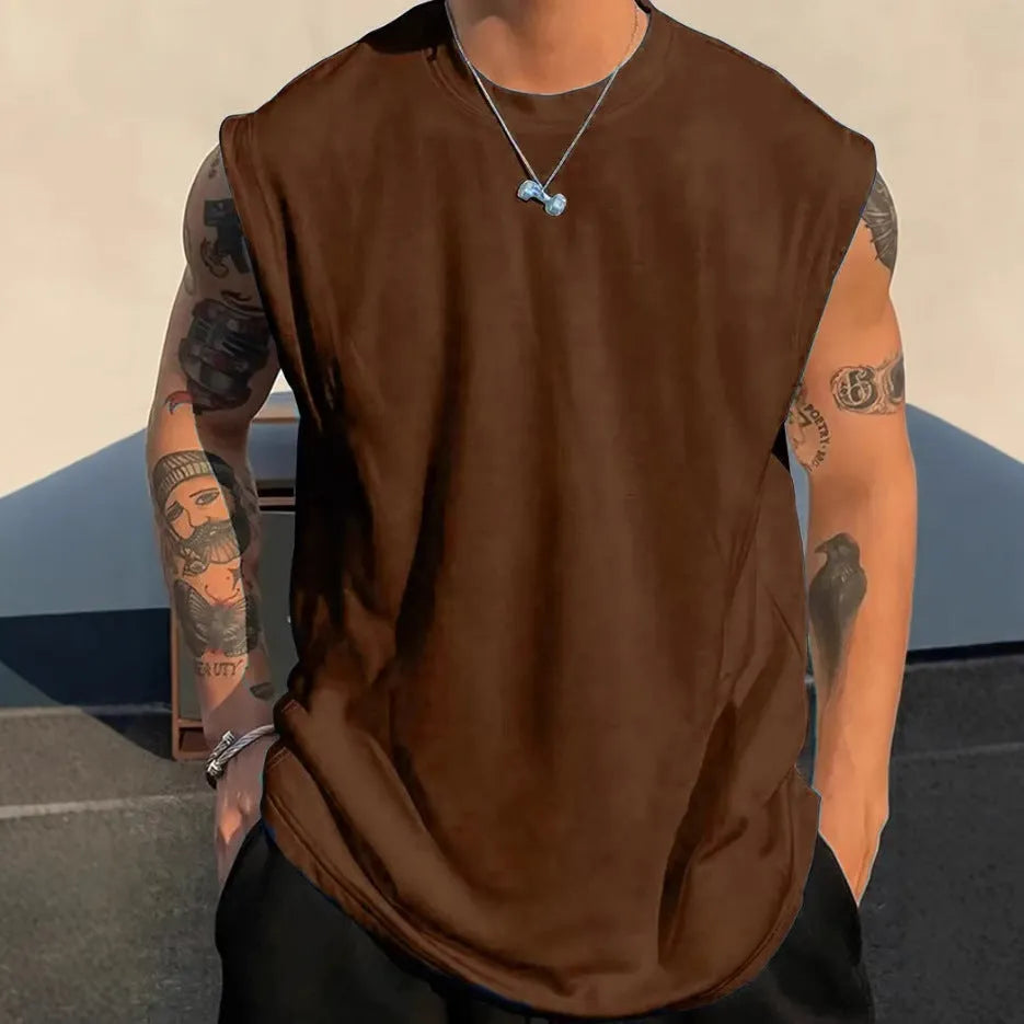 Men's loose-fitting solid colour cotton tank top on a hanger, shown in a light colour.