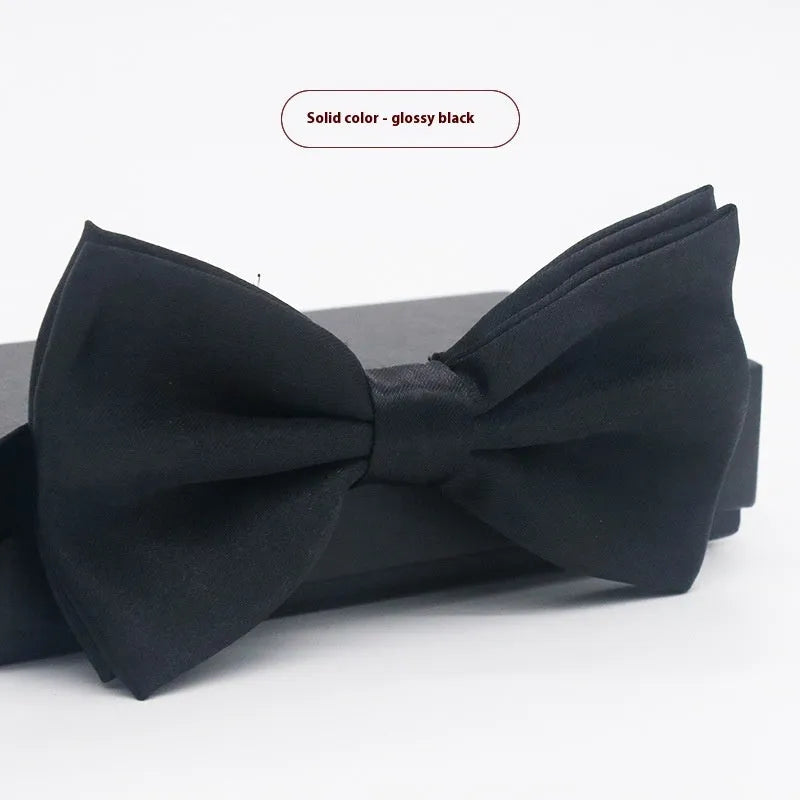 Solid colour flat head bow tie for formal wear in multiple colours including black, red, and blue.