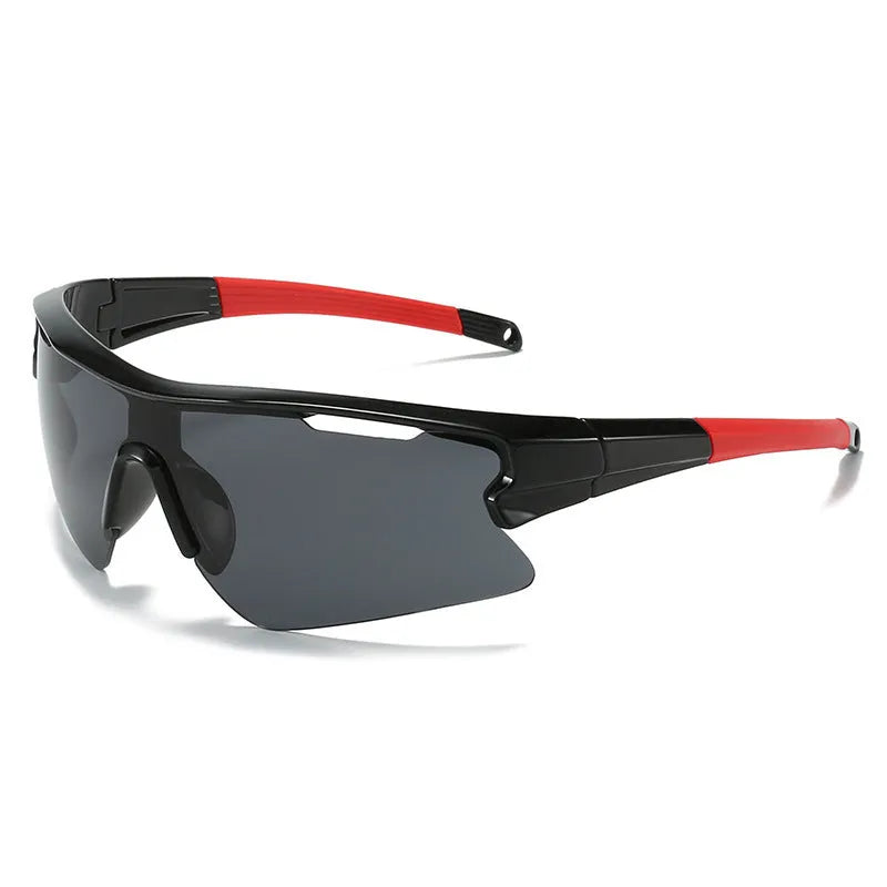 Windproof sports cycling sunglasses in black frame with grey lens on outdoor background.