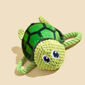 Turtle-shaped dog toy with knotted rope construction and plush stuffing for interactive chewing games