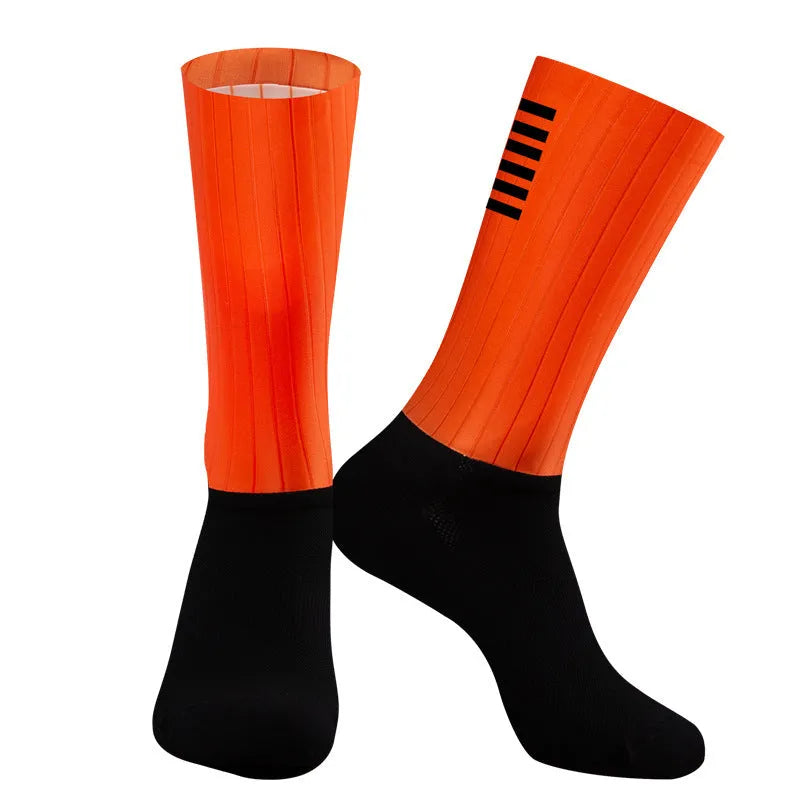 Cycling socks in chemical fibre blend fabric shown in orange, black, purple, white, grey and dark blue colour options
