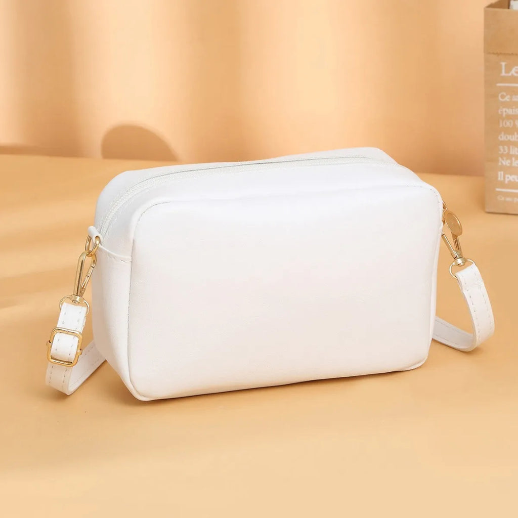 Solid colour PU women's shoulder bag showing three-dimensional pocket, in horizontal square shape.