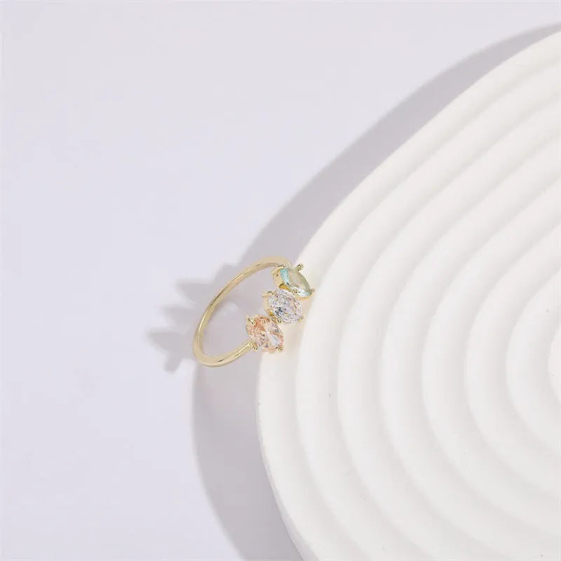 Geometric triangle design women's ring with horse eye motifs and tricolor zircon stones in 14k gold colour