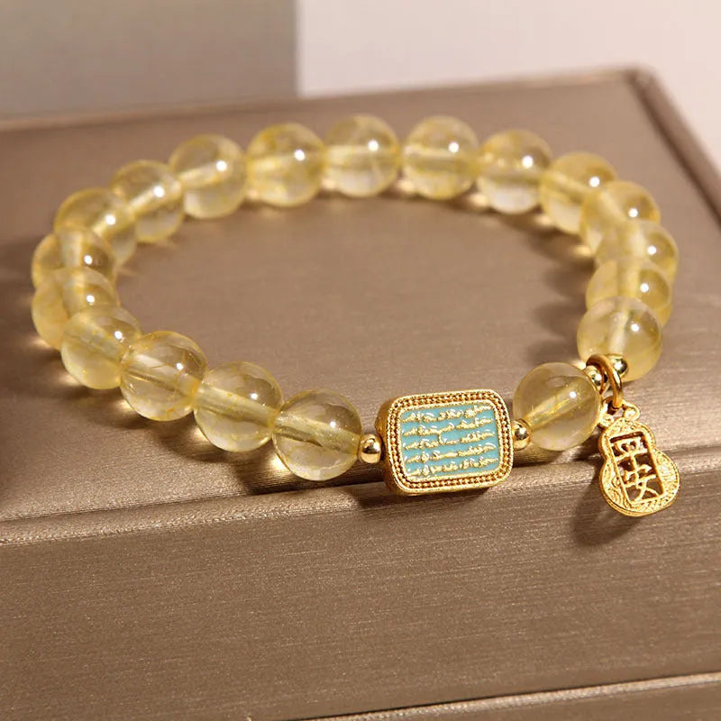Women's natural yellow crystal bracelet with citrine colour tones and rhinestone decorative elements
