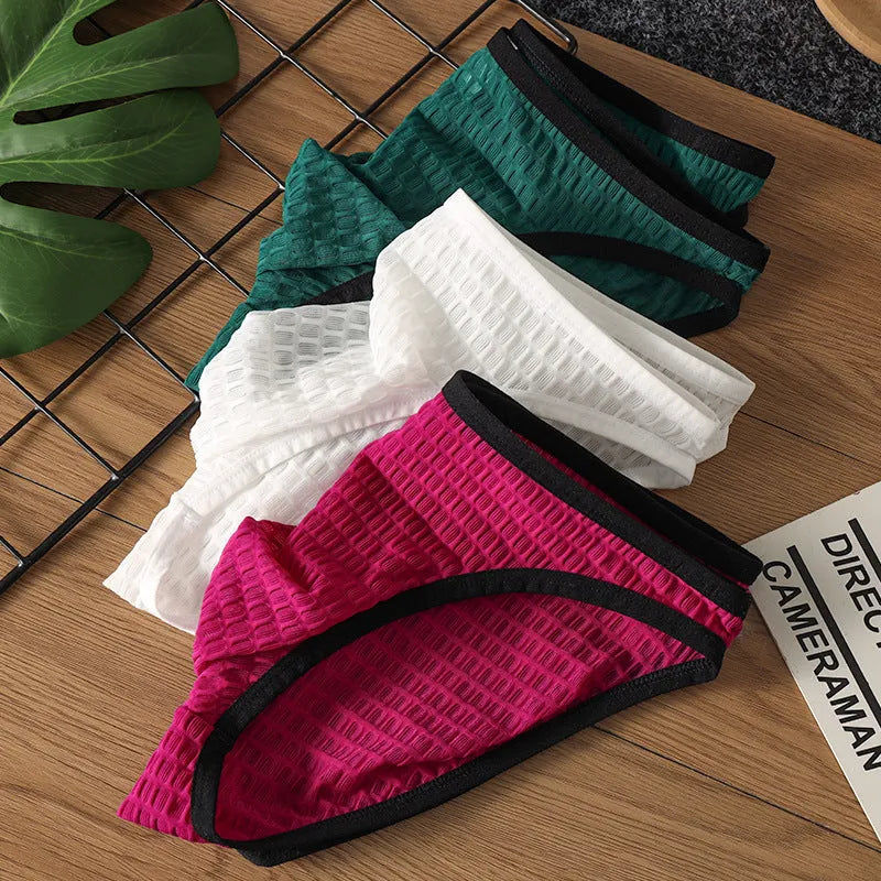 Men's low waist transparent lace underwear in a choice of colours on a size chart.