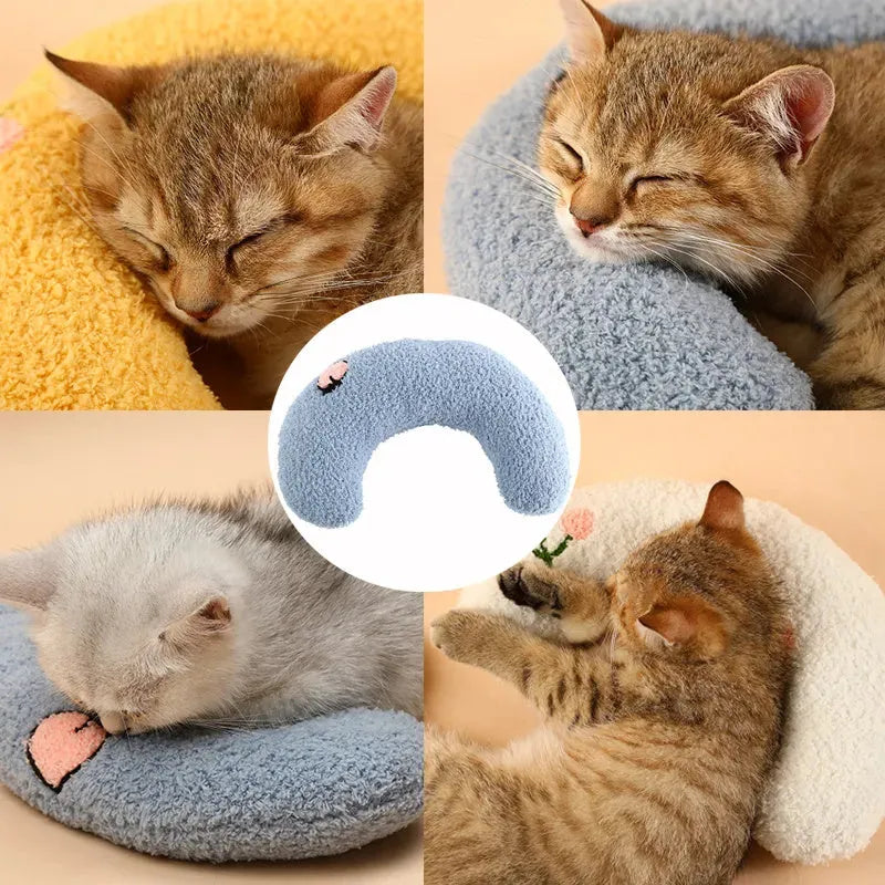 Small half-donut shaped plush pet pillow in blue, showing U-shaped design for cat or small dog neck support.