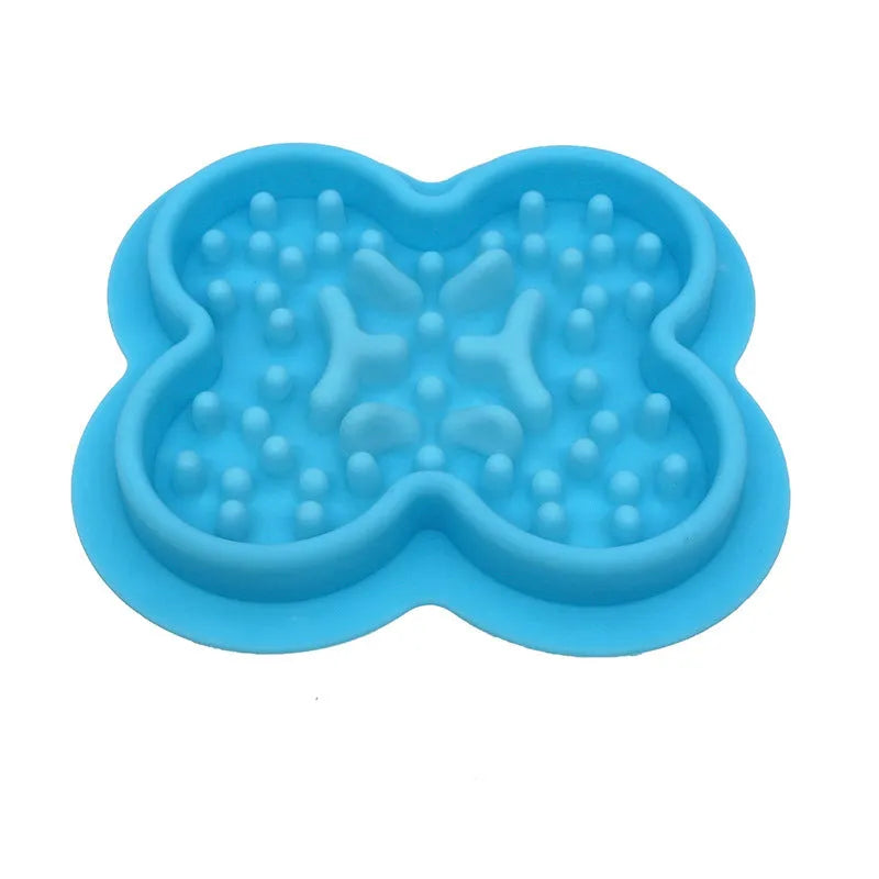 Silicone pet licking pad slow feeder mat in various colours on a floor