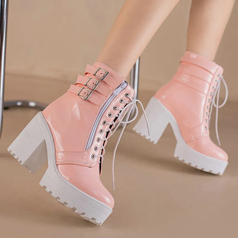 Women's black thick-heeled short boots with lace-up front and round toe on a waterproof platform.