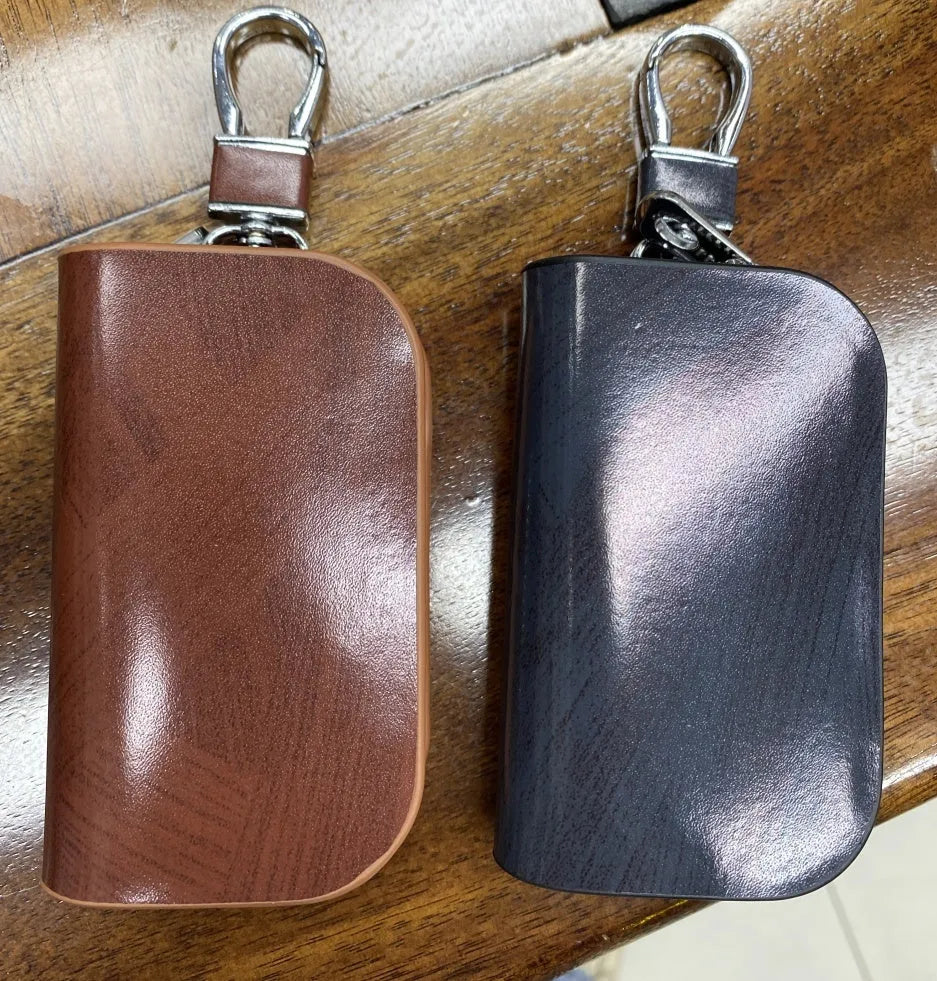 Genuine leather car key case with zipper in frosted black or brown.