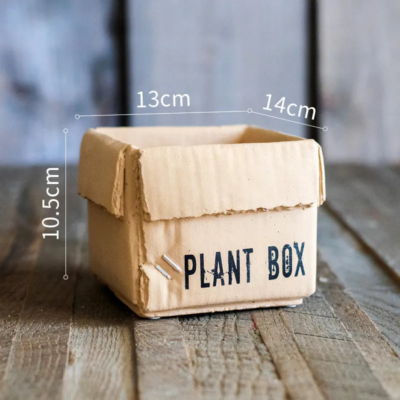 Cement brown paper box style flowerpot with a drainage hole, shown in a Nordic interior setting.