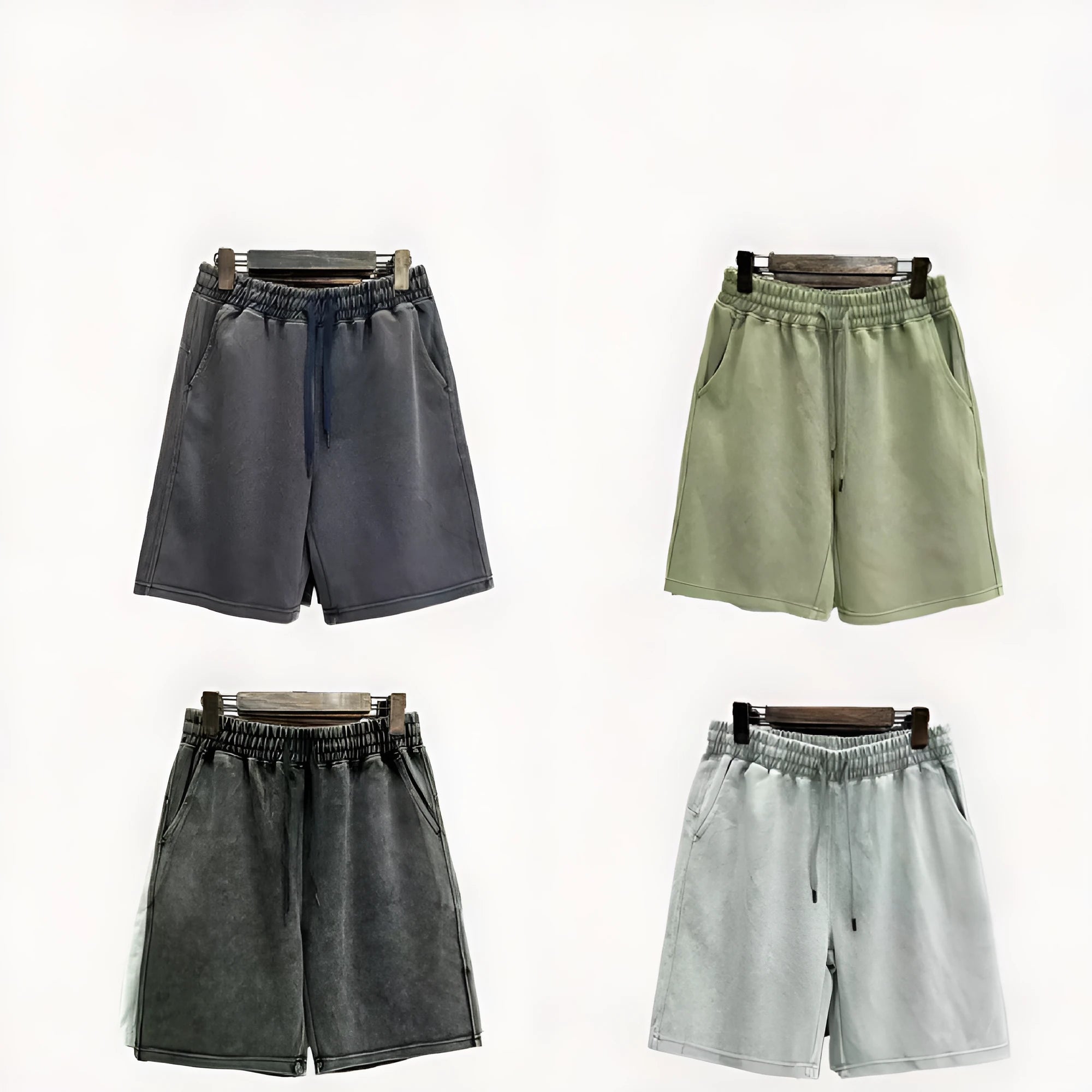 Men's solid colour distressed cotton shorts in a loose straight-leg casual fit.