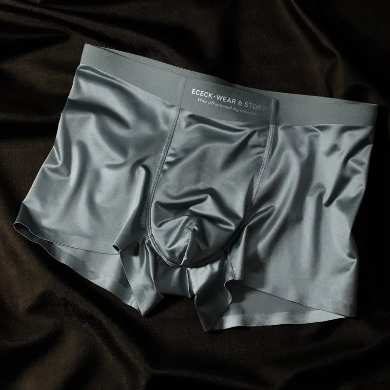 Men's solid colour ice silk seamless underwear laid flat, showing its knit construction.