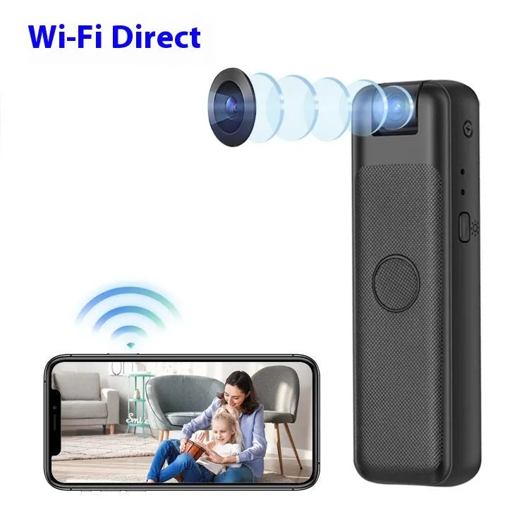 Black USB webcam on a desk with its sliding privacy cover partially closed over the lens.