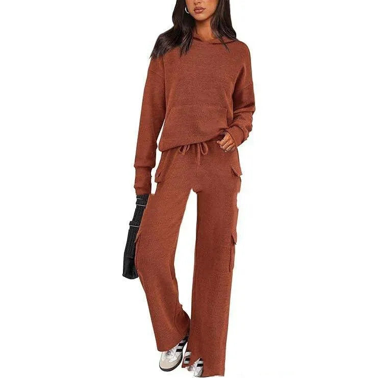Women's black polyester leisure sports suit set with long sleeves and trousers laid flat.