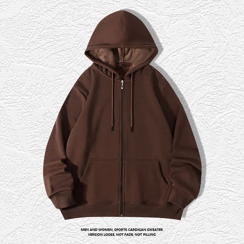 Man wearing a beige heavyweight cotton zip-up hooded cardigan with top-stitched pockets.