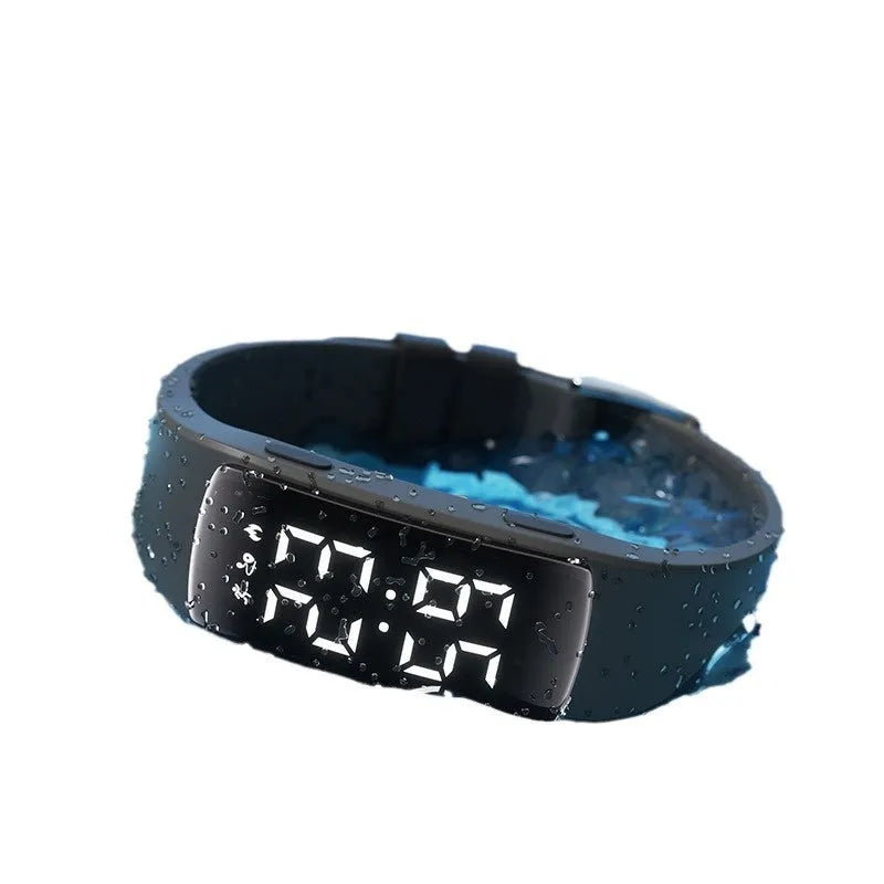 Vibration alarm smart watch with coloured silicone strap and LED display on wrist