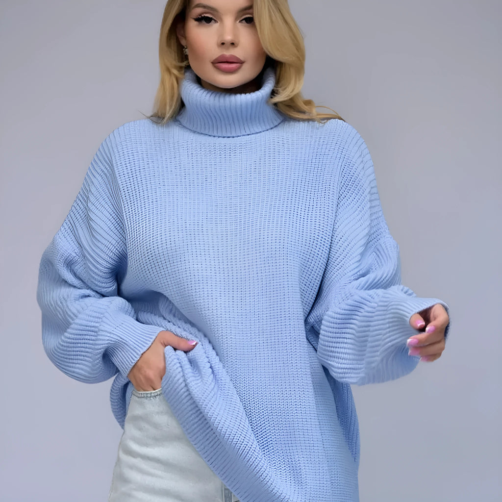 Women's sky blue loose high neck pullover sweater made from thick imitation cashmere fabric.
