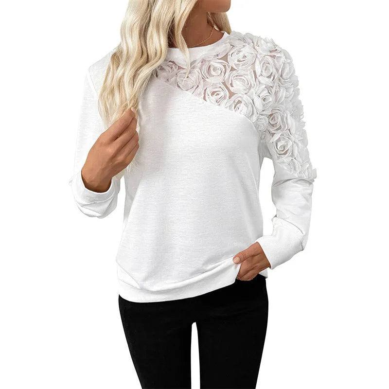 White long sleeve women's blouse with floral pattern, loose fit pullover style.