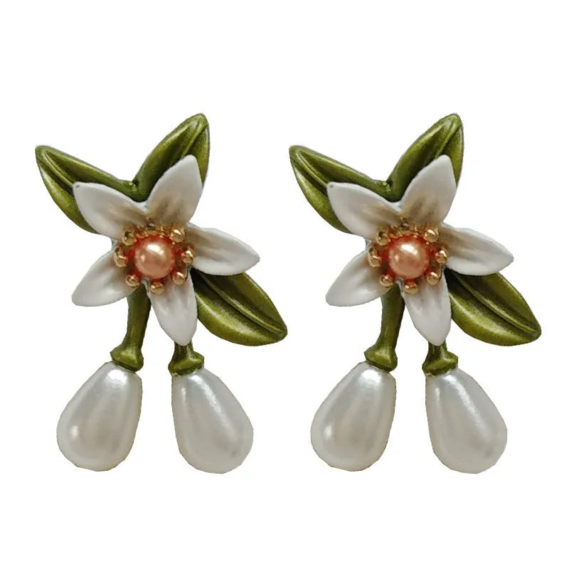 Women's contrast colour floral earrings with sterling silver needle detailing and alloy flower ear clip