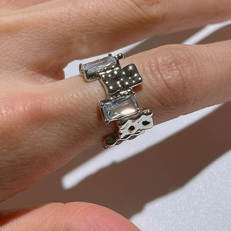 Silver-plated geometric open ring with cross zircon centrepiece and three-dimensional decoration