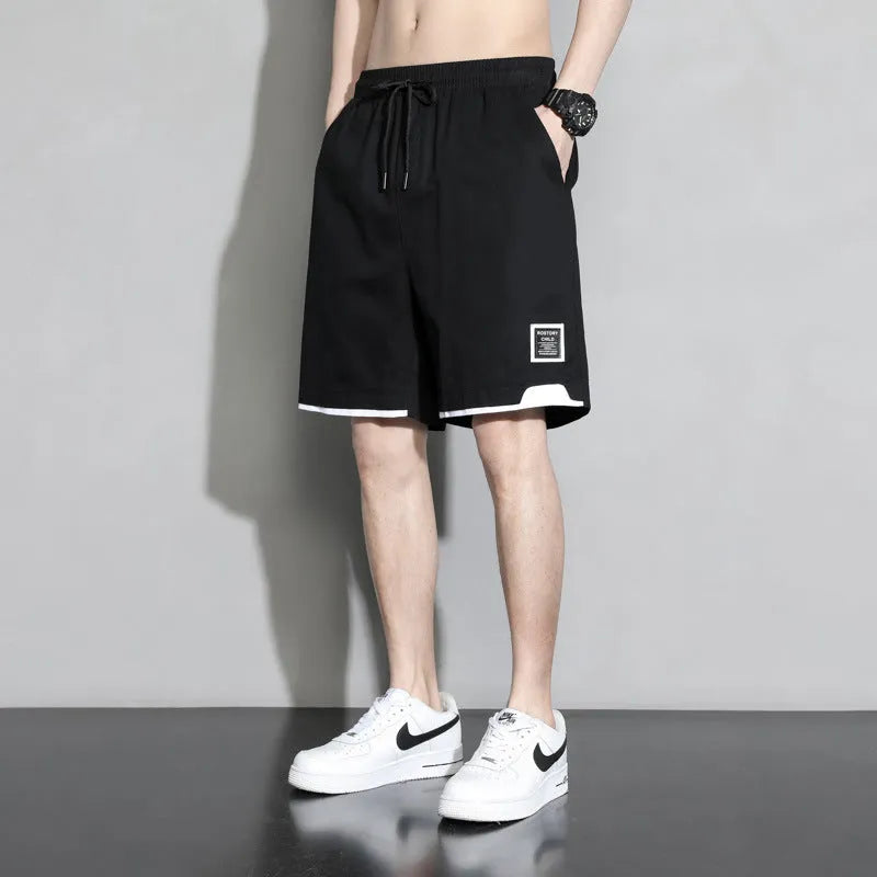 Boys' cotton shorts in black, shown in a casual style for summer home and sports wear.