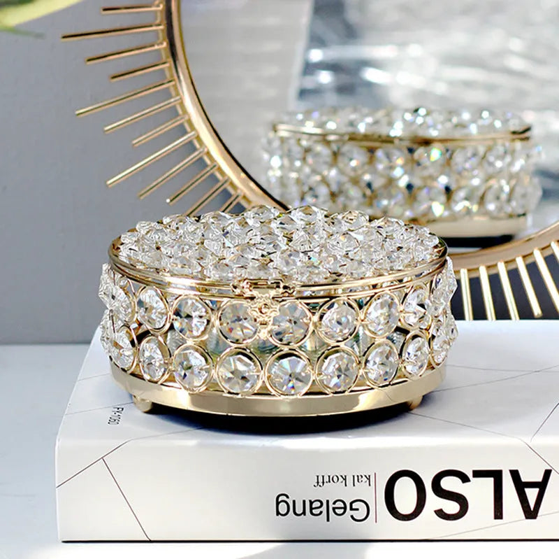 Transparent crystal glass jewellery storage box with French gold metal finish in a European style.