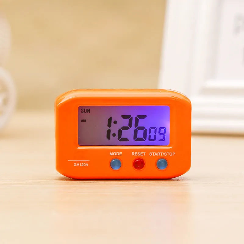Portable LCD alarm clock with luminous display, showing time and date on screen