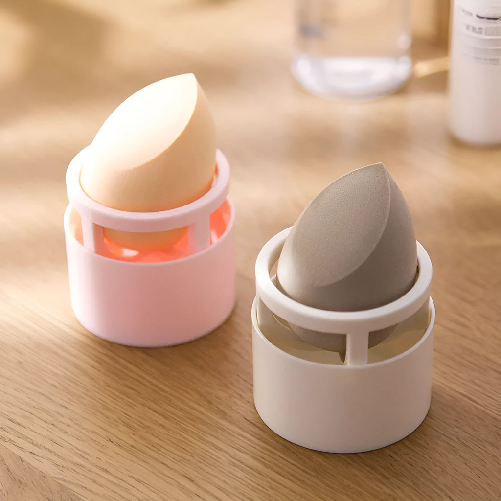 Pink plastic beauty egg stand cosmetics storage rack in girly heart style on a bedroom desktop