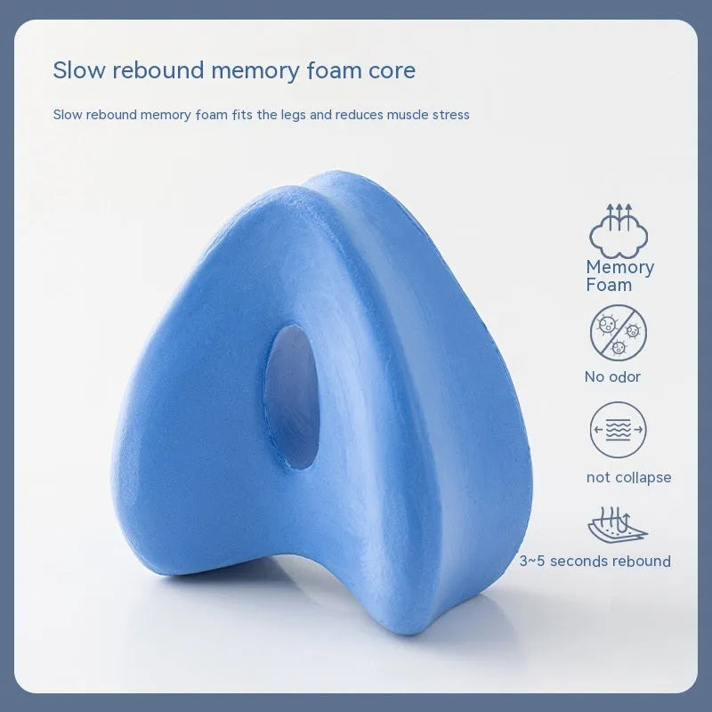 Heart-shaped memory foam leg pillow in blue colour showing dimensions of 25x23x13 cm