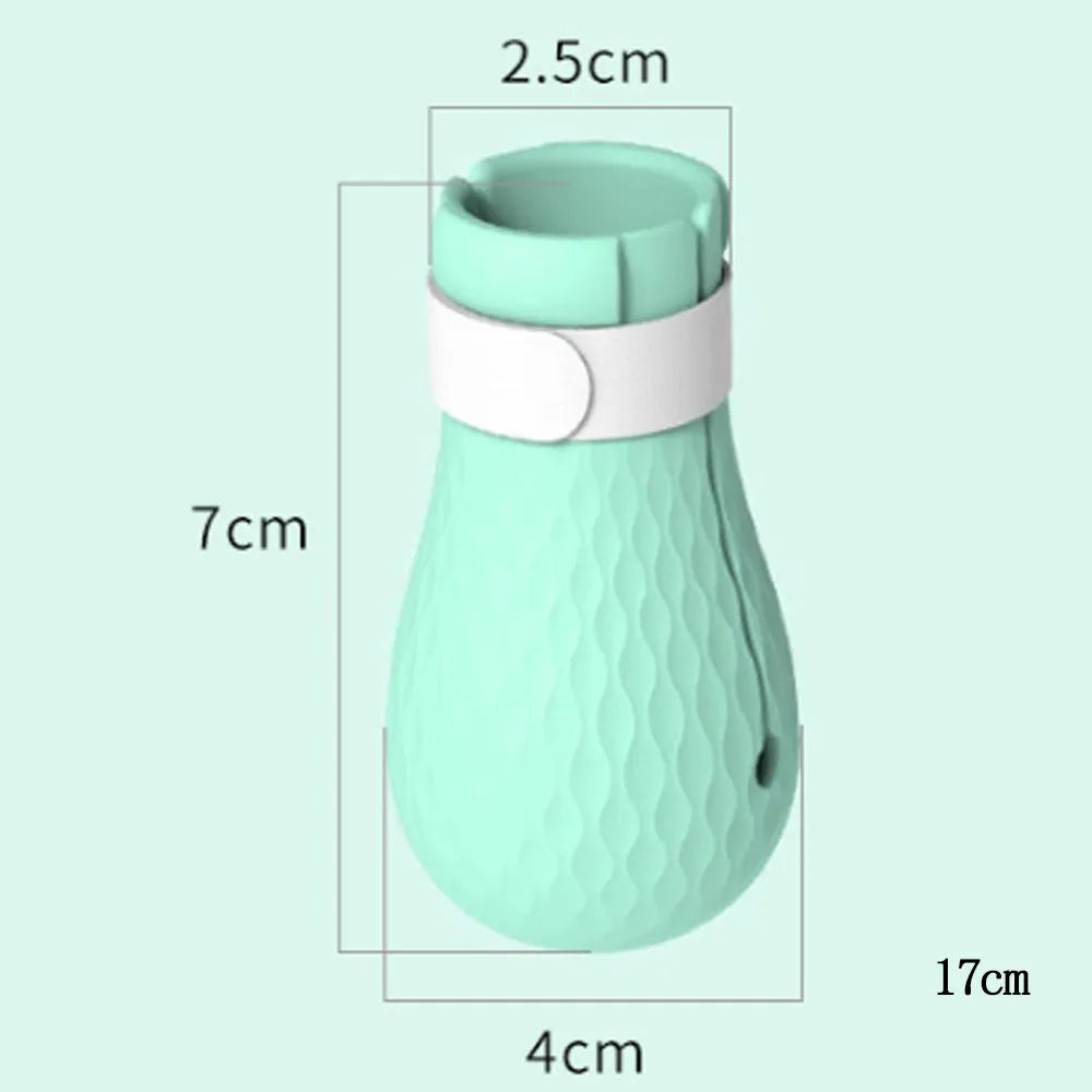 Four green silicone cat paw scratch protection covers with elastic straps