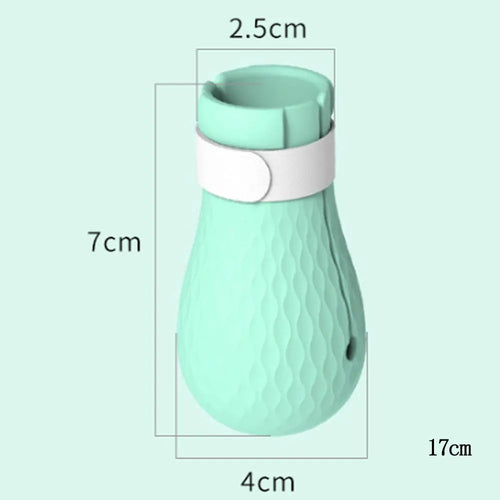 Four green silicone cat paw scratch protection covers with elastic straps