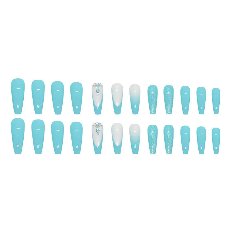 Solid colour long ballet false nails with blue diamond glitter accents and adhesive glue